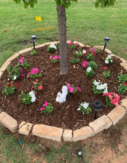 Flower bed with mulch and stone border