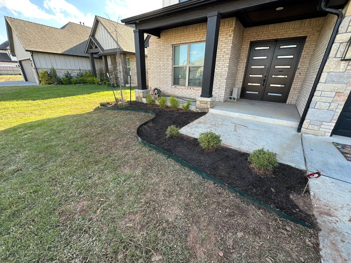 Fresh landscaping with mulch and shrubs