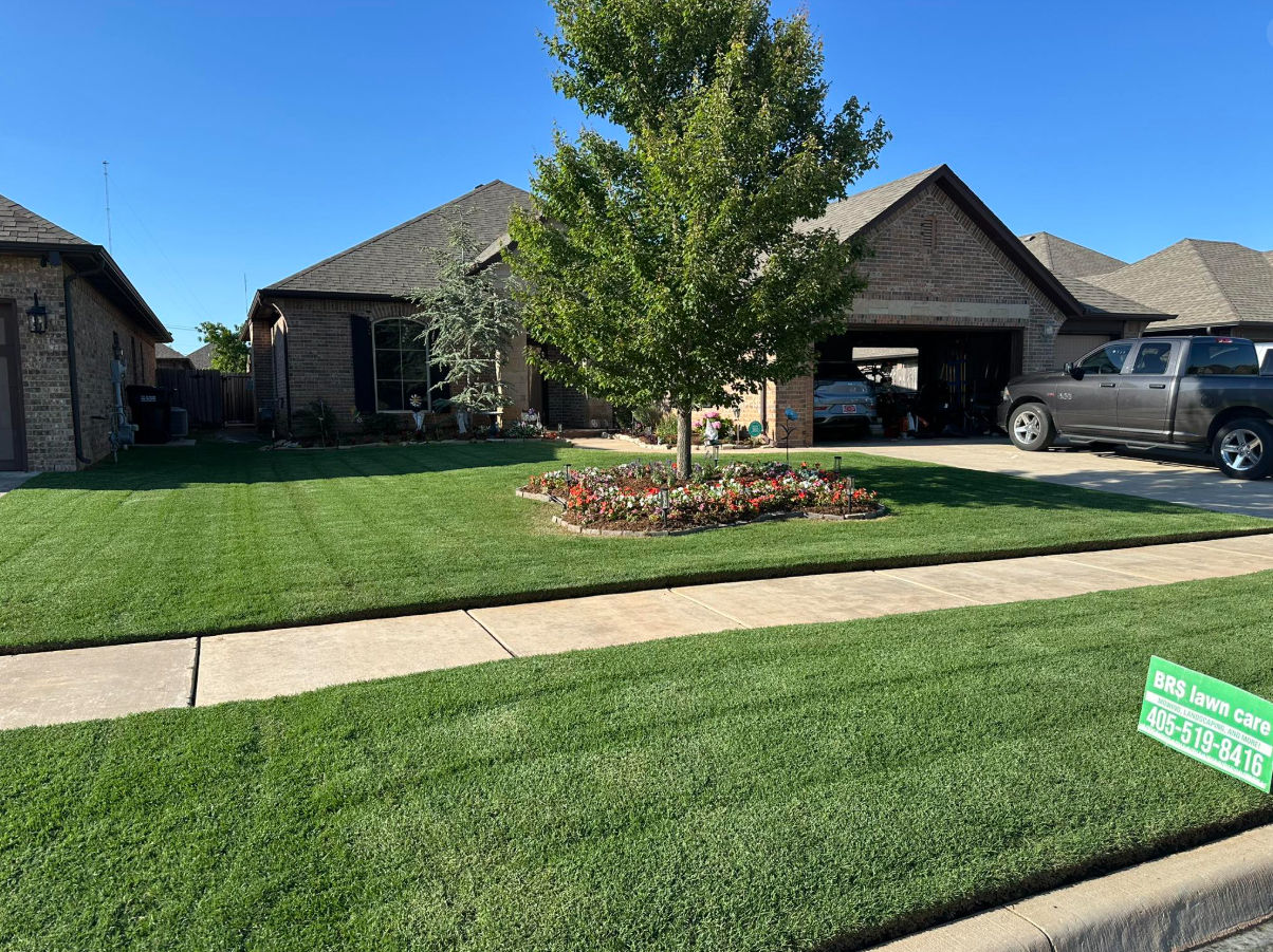 Lush green lawn with flower garden